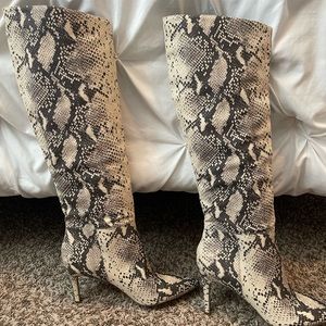 Snake skin print knee high boots